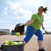 Lincoln pitcher Brooke Snyder tosses a ball into a bucket at second base during practice on Tuesday, May 7. Daniel Brenner I AnnArbor.com